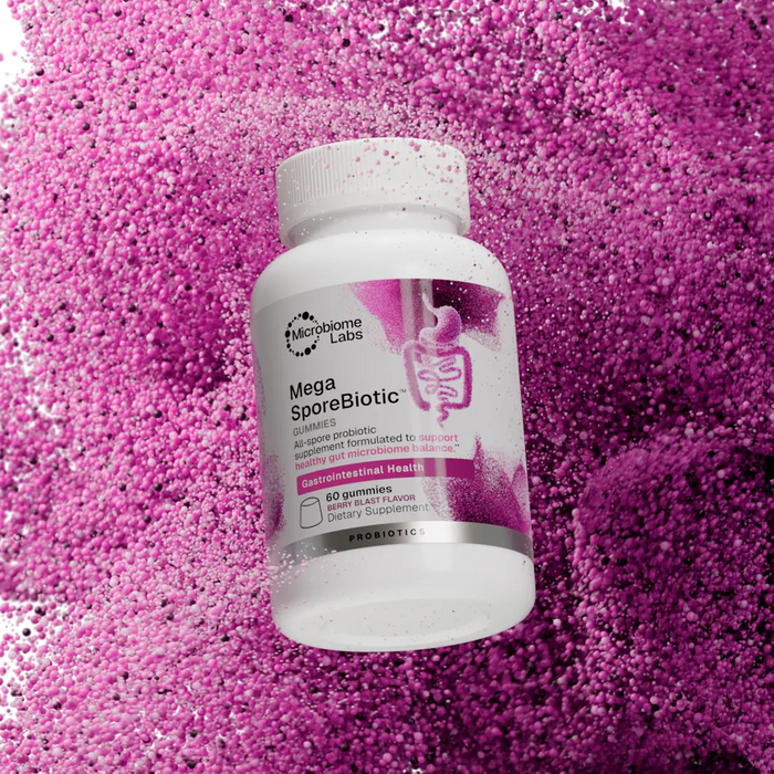 MegaSporeBiotic Gummies bottle surrounded by pink particles