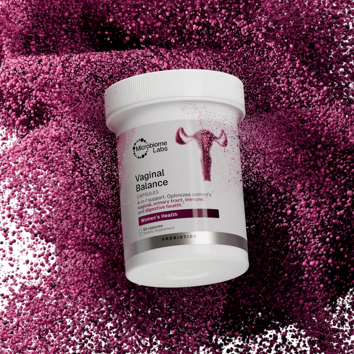 Microbiome Labs Vaginal Balance bottle on a textured pink background